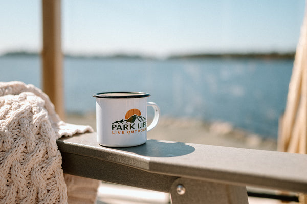 Park Life Camper Mug in front of Lake